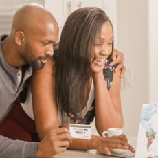 Black man and woman shopping online