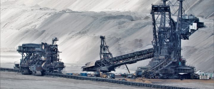 large dug out coal mine and big machinery