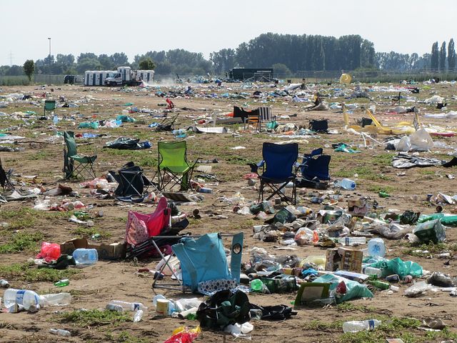 Trash and discarded chairs after a festival