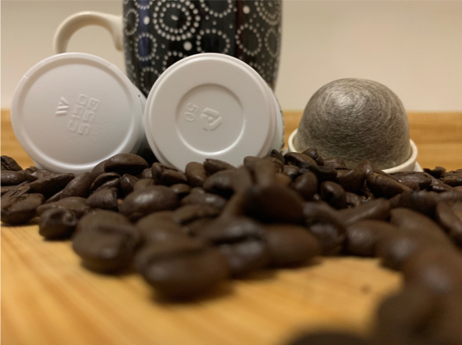 Non-recyclable coffee pod, recyclable coffee pod, compostable coffee pod, coffee beans, and mug