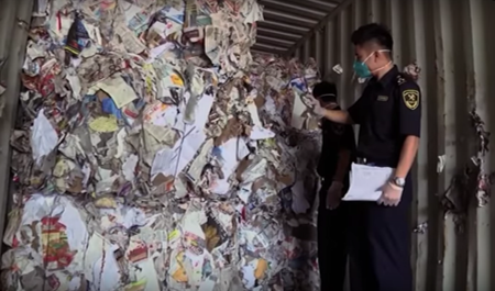Inspectors in China checking waste for being acceptable