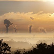 Emissions from industry, in a foggy landscape