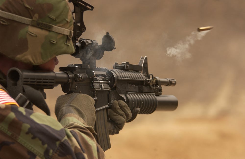 Soldier firing an automatic gun