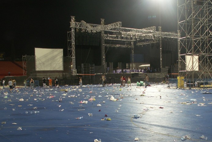 Stadium after a gig - plastic trash all over the floor
