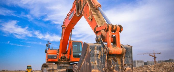 low angle of bright orange digger