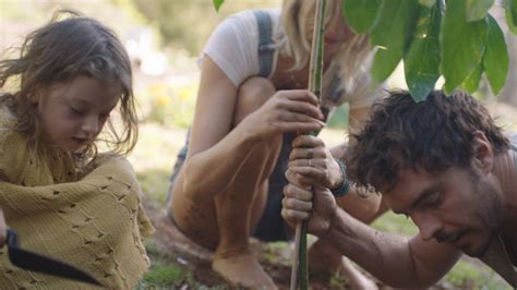 Damon Gameau and his wife and daughter planting a tree