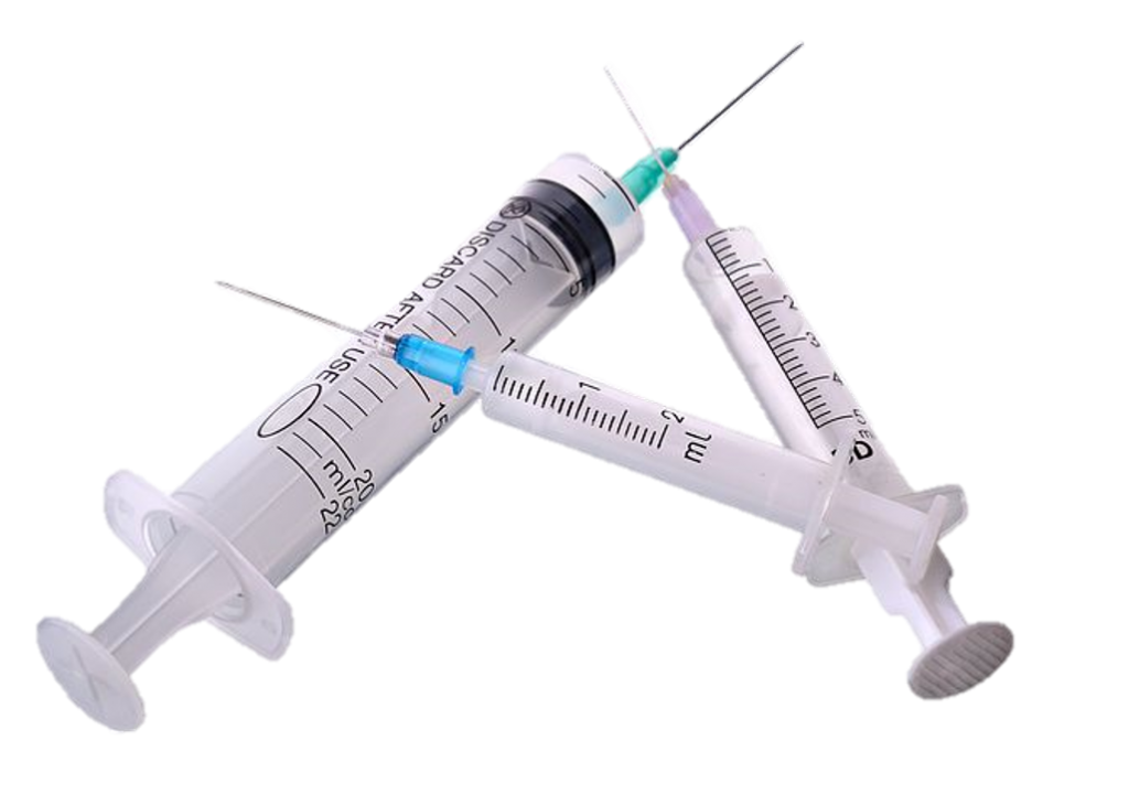 three plastic syringes with needles attached