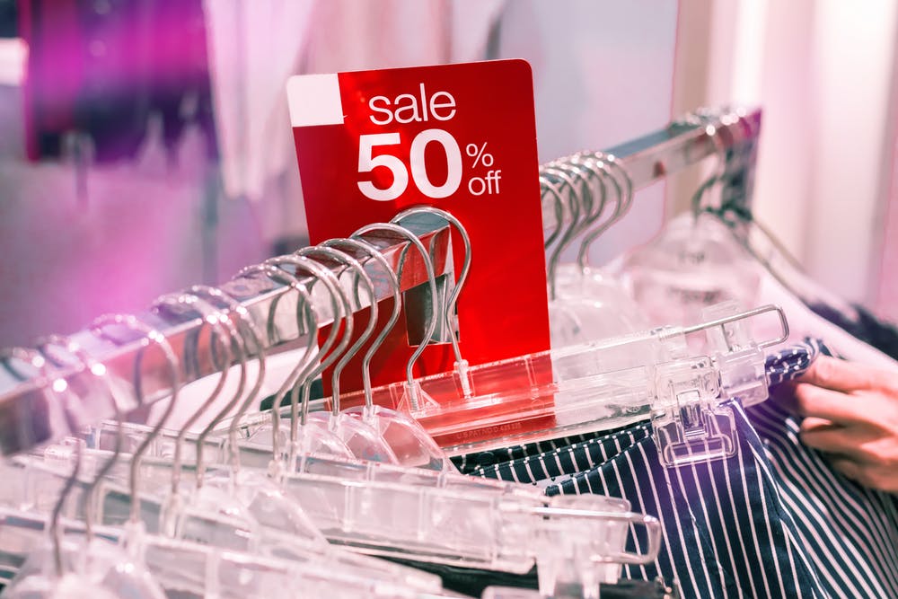 Sale sign on clothing rack