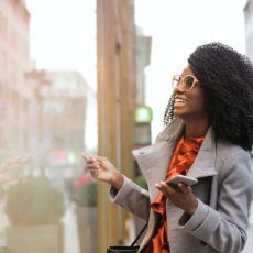 Black woman looking into shop windows
