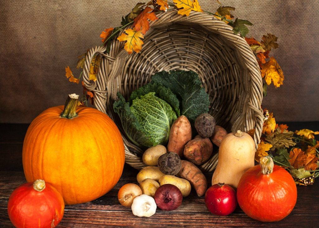 Seasonal produce sitting in overturned basket