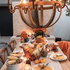 Thanksgiving table set with wooden candelabra over it