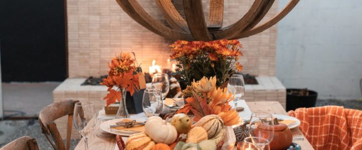 Thanksgiving table set with wooden candelabra over it