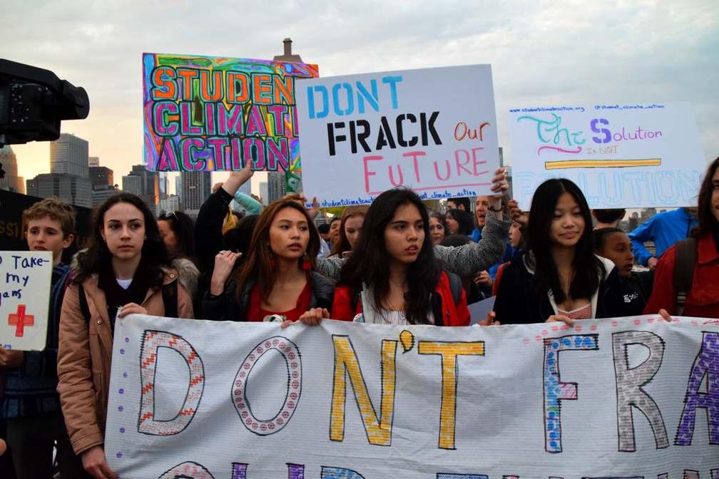 Student protest against fracking, NYC, 2019. Holding signs and posters, looking concerned