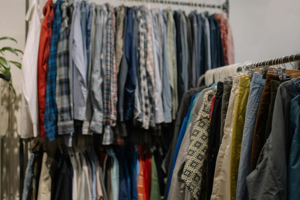 Rows of shirts on hangers in a thrift store