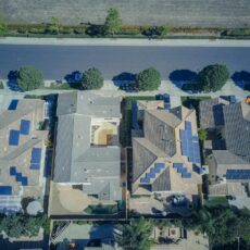 Aerial view of homes with solar panels on the roofs