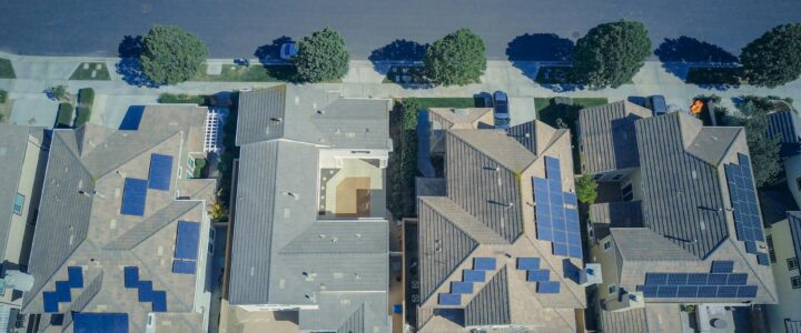 Aerial view of homes with solar panels on the roofs